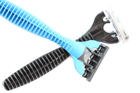 Safety black and blue plastic razor isolated on white background.