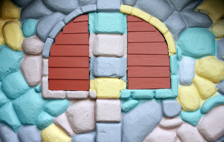 Textured of windows on colorful house wall for the background.の写真素材