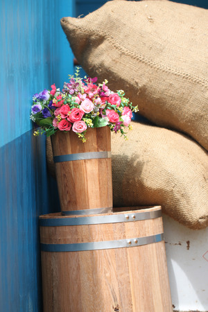 Bouquet of roses in oak barrels.の写真素材