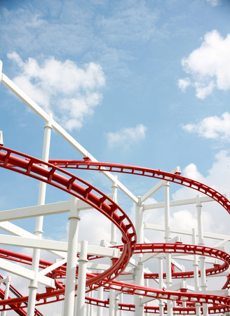 Roller of coaster against blue sky in amusement park.の写真素材