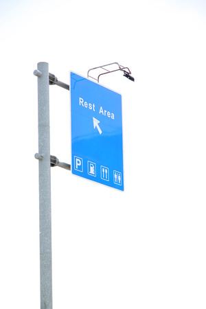Signs of blue and arrows point go to the car rest area on white background.の写真素材