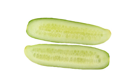 fresh cucumber to slices of isolated on white background.の写真素材