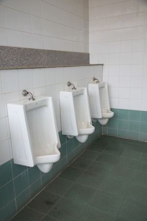 white urinals in the public bathroom.の写真素材