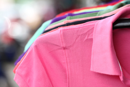 Pink shirt on a hanger in shop.の写真素材