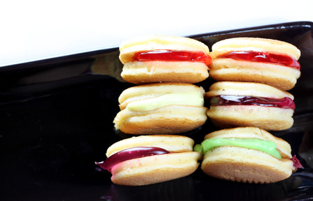 Thailand macaroon in black dish for foods background.