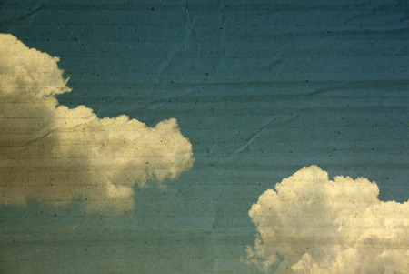 textured paper box of clouds on blue sky for vintage background.の写真素材
