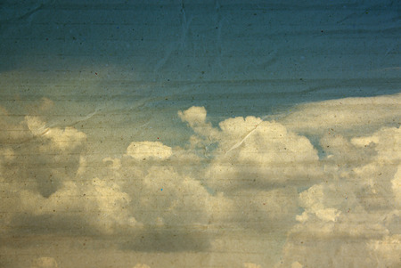 textured paper box of clouds on blue sky for vintage background.の写真素材