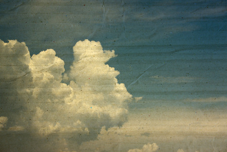 textured paper box of clouds on blue sky for vintage background.の写真素材