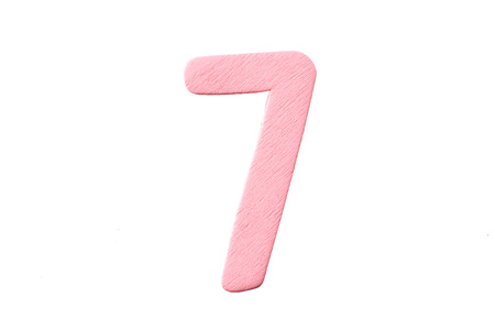 Numbers of wood painted in colorful on white .