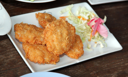 Fried shrimp of foods cake in white dish on the table.の写真素材