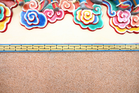 pattern art on a wall in Chinese temple for background.の写真素材