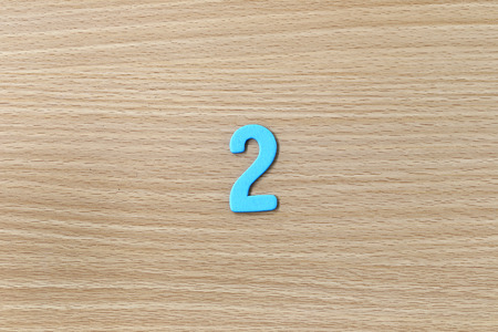 Arabic numbers of colorful on wood background.の写真素材