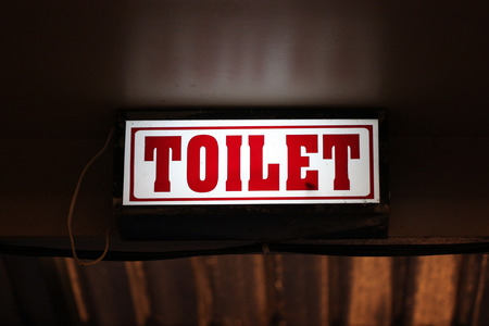 LED signs provide directional to the toilet.の写真素材