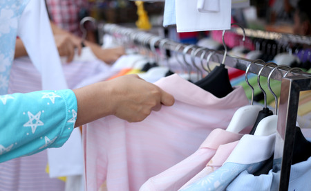 Colorful clothes hanging on clothesline.の写真素材