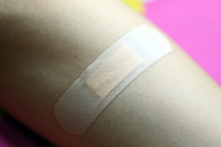 Adhesive plaster on skin of women.