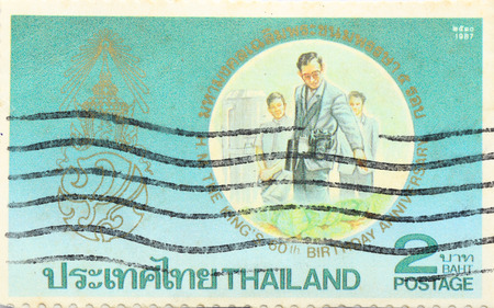 BANGKOK - A old stamp printed by Thailand Post circa 1987 and shows image of Monarch Rama 9,THAILANDのeditorial素材