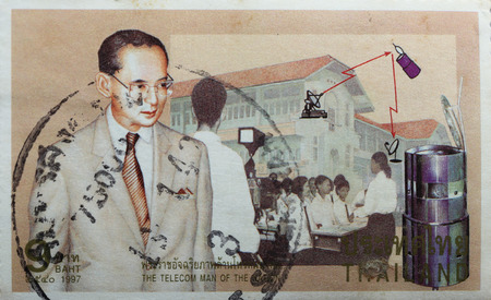 BANGKOK THAILAND - A old stamp printed in Thailand shows image of Great king rama 9 Thailand,A stamp printed by Thailand Post circa 1997.のeditorial素材