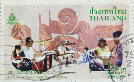 BANGKOK - A old stamp printed by Thailand Post circa 1992 and shows image of Kasetsart University Open University,THAILAND.のeditorial素材