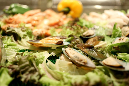 Baked mussels and shrimp in a restaurant.の写真素材