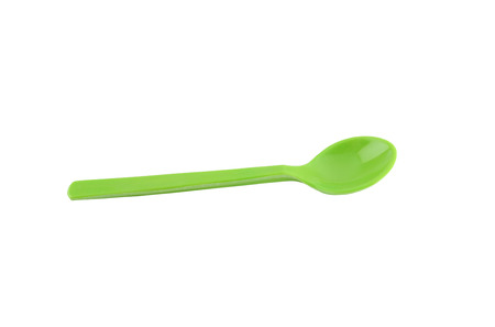 Green plastic spoon isolated on white background with clipping paths.の写真素材