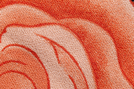 orange flower pattern on the fabric for the background.の写真素材