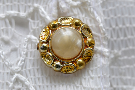 studs pearls on a white shirt in a macro.の写真素材