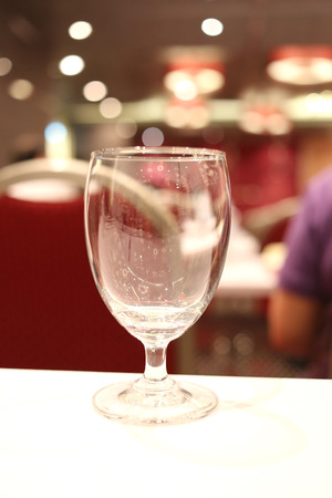 Glass of water on a table in the meeting room.の写真素材