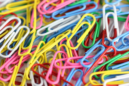 pile of colorful paperclip for background.の写真素材