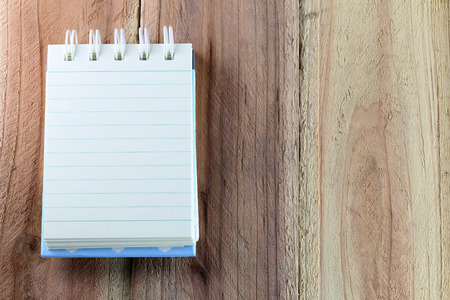 Notebook on wood background.の写真素材