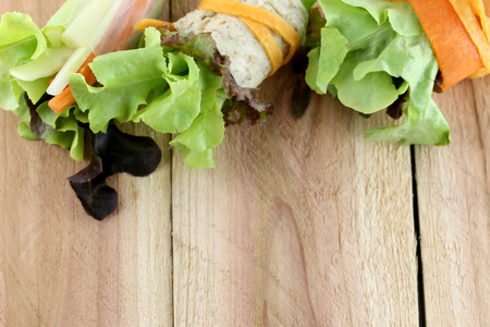 roll salad on wood background.の写真素材