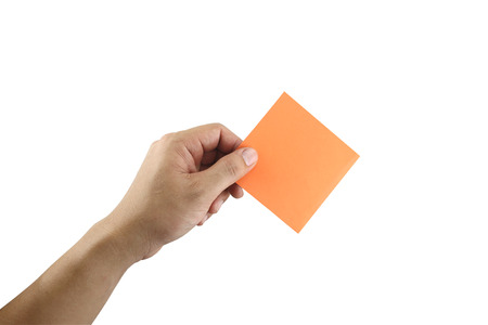 Man's arm showing orange note paper in hand and isolated on white background with clipping paths.の写真素材