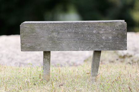 Old wooden sign in the park.