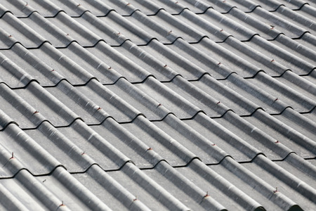 Old weathered tile roof for the design background.