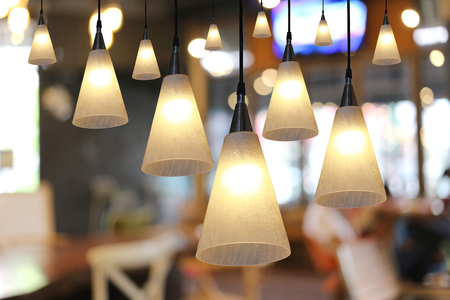 Warm lighting modern ceiling lamps in the cafe and interior decoration restaurant.の写真素材