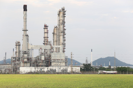 Oil refinery and green lawn in the evening.のeditorial素材