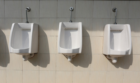white ceramic of urinals in men's bathroom,sanitary ware for men.の写真素材