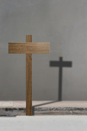 Blank of wooden sign to input text and black shadow in cross shape,concept risks.の写真素材
