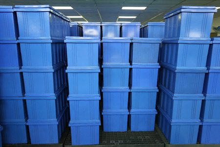 blue Plastic box products in Industrial factory room,Container of finished goods germ-free.の写真素材