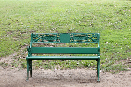 Green chair or bench on ground in public park and nobody,There is space available for use.の写真素材