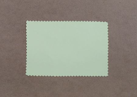 Paper note is empty space on brown wooden for design background and you can input text to it.