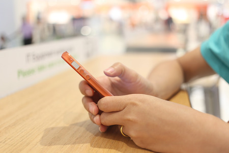 Smart phone in woman hand and to play application programs search data.