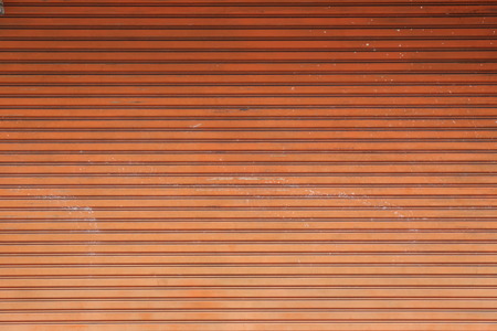 surface of the old steel doors orange for the design background.の写真素材