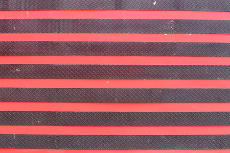 surface of the old steel doors black and red color for the design background.の写真素材