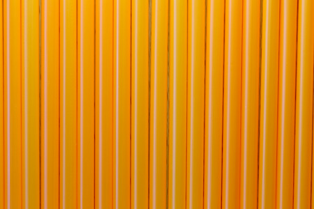 Drink tube of Orange color in abstract background for the design idea backdrop.の写真素材