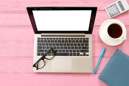 Equipment on desk in a office and copy space for input ideas and business concepts on pink wooden...