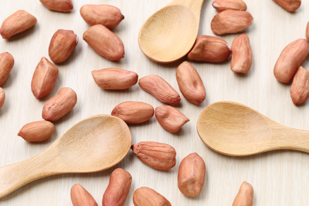 peanut and wooden spoon on wood background,concept of healthy food.の写真素材