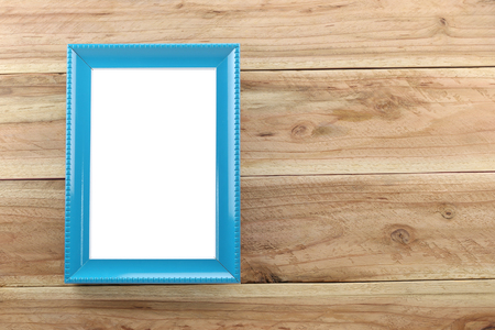 Vintage blue Photo frame on wooden background and you can input picture or data and text to empty space.の写真素材