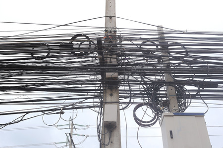 Messy cable electricity post due to poor planning on installing the cable system.
