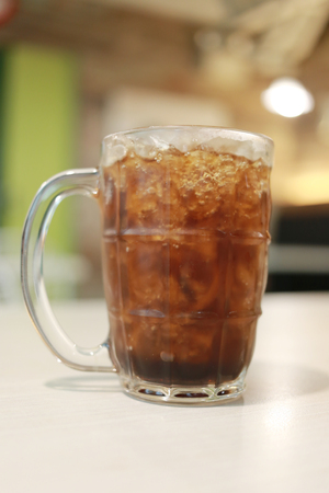 Coca Cola glass on the food table in the restaurant.の写真素材