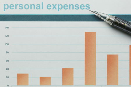 Black pen placed on business graph paper in concept of profitability and analysis of business information.の写真素材